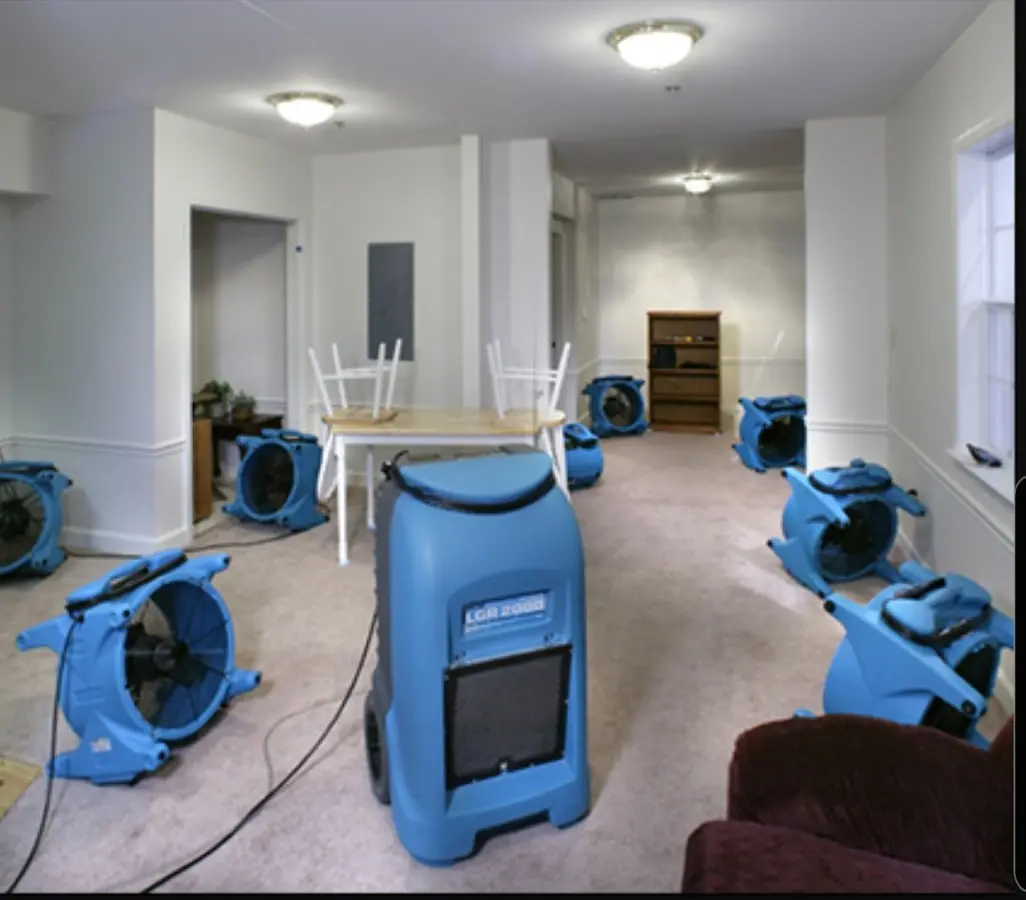 Air movers and dehumidifier setup for Water Damage Restoration in Milford